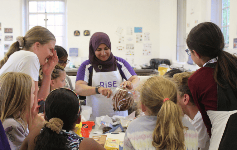 Girls baking on cookery course